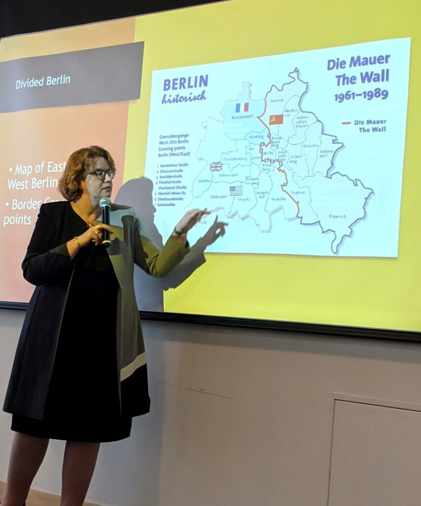 Dr. Warren giving a presentation on the Berlin Wall